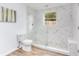 Stylish bathroom with marble walk-in shower and modern fixtures at 1300 Montego Ln, Orlando, FL 32807