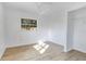 Bright bedroom features a window for natural light, ceiling fan, and light wood flooring at 1300 Montego Ln, Orlando, FL 32807