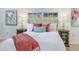 Bright bedroom features a plush headboard, warm color accents, and stylish wood nightstands with see-through doors at 1300 Montego Ln, Orlando, FL 32807