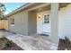 Inviting front entrance with brick accents and a tiled walkway leading to the front door at 1300 Montego Ln, Orlando, FL 32807