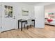 Bright office area featuring a work desk and adjacent doorway leading into the main bedroom at 1300 Montego Ln, Orlando, FL 32807