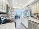 A bright kitchen shows pendant lighting, granite counters and stainless steel appliances at 1302 Stearman Ct # 1, Orlando, FL 32825