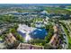 A community with lake views offers a pool and lounge area for residents to enjoy by the water at 1357 Venezia Ct # 402, Davenport, FL 33896