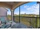 Screened balcony with seating area overlooking the lush landscaping at 1357 Venezia Ct # 402, Davenport, FL 33896