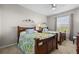 Comfortable bedroom featuring two beds with floral bedding and a bright window at 1357 Venezia Ct # 402, Davenport, FL 33896