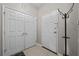 Bright entryway with tile floors, coat rack, and closet for organized storage at 1357 Venezia Ct # 402, Davenport, FL 33896