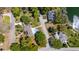 Aerial view of home highlighting a sparkling pool, manicured landscaping, and surrounding serene neighborhood at 1400 Tedford St, Eustis, FL 32726