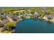 Scenic aerial view of a lakeside community featuring beautiful homes with docks and boat access to the water at 1400 Tedford St, Eustis, FL 32726