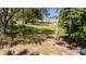Lush backyard with mature trees, providing ample shade and privacy at 1400 Tedford St, Eustis, FL 32726