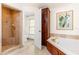 Bathroom featuring a soaking tub and separate tile shower at 1400 Tedford St, Eustis, FL 32726