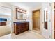 Bright bathroom features a shower, wooden vanity, and tile floors at 1400 Tedford St, Eustis, FL 32726