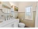 Bright bathroom with modern fixtures, a vanity, and a window at 1400 Tedford St, Eustis, FL 32726