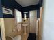 This bathroom has blue and yellow accents with a pedestal sink at 1400 Tedford St, Eustis, FL 32726