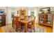 Dining room with wood furniture, decorative rug, and natural light at 1400 Tedford St, Eustis, FL 32726