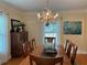 Charming dining room with a wood table and a unique light fixture at 1400 Tedford St, Eustis, FL 32726