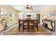 Dining room featuring a table with chairs, a rug, and decor at 1400 Tedford St, Eustis, FL 32726