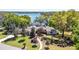 Beautiful single-story home with well-manicured lawn and landscape overlooking serene lake at 1400 Tedford St, Eustis, FL 32726