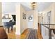 Welcoming foyer with hardwood floors, elegant lighting, and classic architectural details at 1400 Tedford St, Eustis, FL 32726