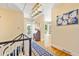 Elegant foyer featuring hardwood floors, staircase, and a decorative chandelier at 1400 Tedford St, Eustis, FL 32726