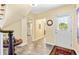 Inviting home foyer with tiled flooring, multiple entryways, and a view into the dining room at 1400 Tedford St, Eustis, FL 32726