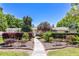 Inviting single-story home with a walkway surrounded by lush landscaping and trimmed hedges at 1400 Tedford St, Eustis, FL 32726