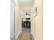 Hallway with views into the dining room, showcasing the seamless flow of the home's layout at 1400 Tedford St, Eustis, FL 32726