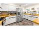 Well-lit kitchen with stainless steel appliances and wood countertops at 1400 Tedford St, Eustis, FL 32726