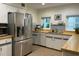 This kitchen includes butcher block countertops and stainless-steel appliances at 1400 Tedford St, Eustis, FL 32726