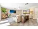 Spacious living room featuring a large screen television and comfortable seating at 1400 Tedford St, Eustis, FL 32726