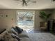 Cozy living room showcasing a view of the inviting outdoor pool area at 1400 Tedford St, Eustis, FL 32726