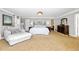 Spacious main bedroom with a comfortable sitting area and en-suite bathroom entrance at 1400 Tedford St, Eustis, FL 32726