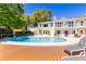 Resort-style pool with a spacious deck and a serene view of the water at 1400 Tedford St, Eustis, FL 32726