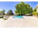Large outdoor pool surrounded by lush landscaping at 1400 Tedford St, Eustis, FL 32726