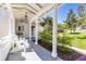 Charming front porch with hanging flower baskets and comfortable seating at 1400 Tedford St, Eustis, FL 32726