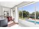 Light-filled sunroom overlooking a sparkling pool and lush backyard at 1400 Tedford St, Eustis, FL 32726