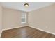 Bright bedroom with laminate flooring and large windows creates a welcoming space at 14806 Del Morrow Way, Orlando, FL 32824