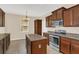 Well-equipped kitchen featuring granite countertops and stainless steel appliances at 14806 Del Morrow Way, Orlando, FL 32824