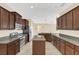 Spacious kitchen featuring stainless steel appliances, granite countertops, and a kitchen island at 14806 Del Morrow Way, Orlando, FL 32824