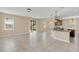 Spacious living room with tile floors, opening to the outdoor patio via sliding glass doors at 14806 Del Morrow Way, Orlando, FL 32824