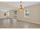 Light-filled living area featuring tile flooring and access to the outside patio at 14806 Del Morrow Way, Orlando, FL 32824