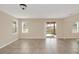 Bright living room with tile flooring and sliding glass doors to the backyard at 14806 Del Morrow Way, Orlando, FL 32824