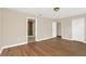 Spacious main bedroom with ensuite bathroom, natural light, and wood-look floors at 14806 Del Morrow Way, Orlando, FL 32824