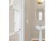 View of powder room with pedestal sink and decorative mirror at 14806 Del Morrow Way, Orlando, FL 32824