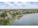 Aerial view of the community showing the beautiful waterfront, boat docks, lush landscaping, and buildings at 151 N Orlando Ave # 229, Winter Park, FL 32789