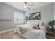 Cozy bedroom featuring a ceiling fan, decorative plants, a serene color palette, and a comfortable bed at 151 N Orlando Ave # 229, Winter Park, FL 32789