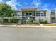 Inviting multi-Gathering residence featuring staircases, large windows, and well-maintained landscaping at 151 N Orlando Ave # 229, Winter Park, FL 32789