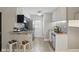 Modern kitchen featuring stainless steel appliances, granite countertops, and ample cabinet space at 151 N Orlando Ave # 229, Winter Park, FL 32789