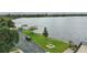 Scenic lakeside park with lush green space, picnic tables, benches, and kayak racks at 151 N Orlando Ave # 229, Winter Park, FL 32789