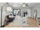 Stylish living room with cozy seating, modern decor, and an open doorway to an adjacent dining area at 151 N Orlando Ave # 229, Winter Park, FL 32789