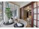 Stylish sunroom featuring large windows, a round dining table, comfortable chairs, and lots of sunlight at 151 N Orlando Ave # 229, Winter Park, FL 32789